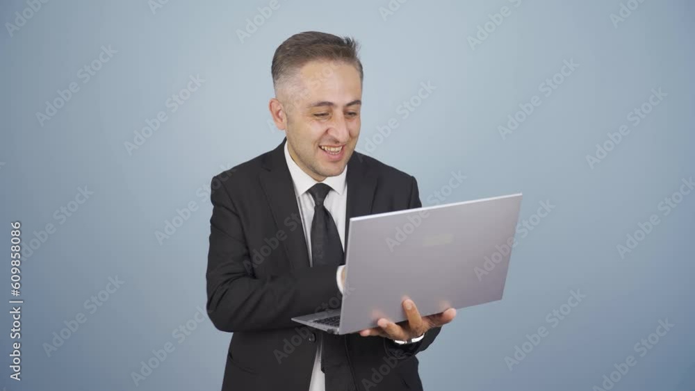 Businessman looking at laptop with excitement. Businessman looking at laptop with excitement.
