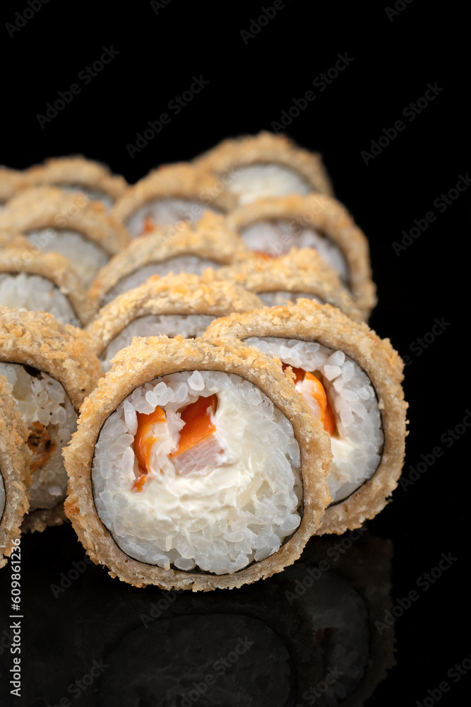 Fried tempura sushi rolls set close up selective focus. Japanese traditional food, restaurant menu background Fried tempura sushi rolls set close up selective focus. Japanese traditional food, restaurant menu background