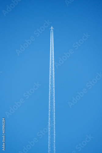 simple plane in sky on blue background