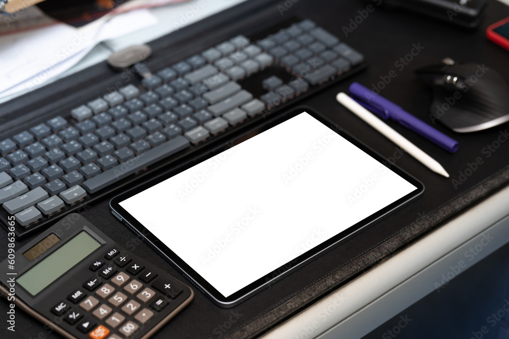Digital tablet blank screen on the desk with Keyboard calculator pen and mouse. Digital tablet blank screen on the desk with Keyboard calculator pen and mouse.
