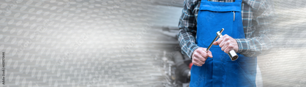 Fotografie Car mechanic with car engine on background; panoramic banner