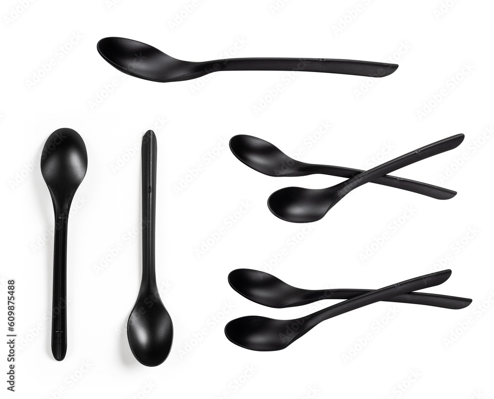 Plastic black matte disposable spoons isolated on a white background. Collection Plastic black matte disposable spoons isolated on a white background. Collection