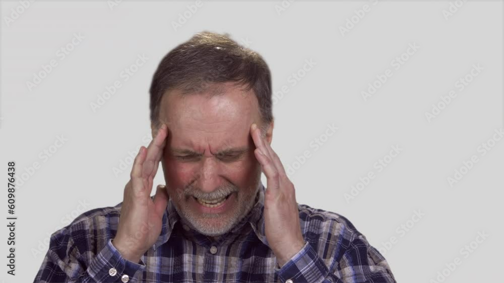 Aged senior man toucing his head with both hands. Isolated on white. Aged senior man toucing his head with both hands. Isolated on white.