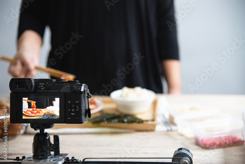 people using digital camera taking food photograph or video studio production