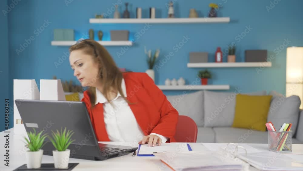 Home office worker woman finds what she is looking for on the table. Home office worker woman finds what she is looking for on the table.