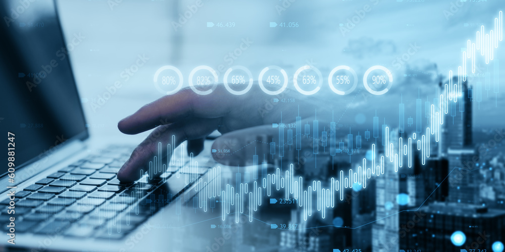 Close up of hand using laptop with creative candlestick forex chart or graph on blurry wide city background. Financial trade market and stock concept. Double exposure. Close up of hand using laptop with creative candlestick forex chart or graph on blurry wide city background. Financial trade market and stock concept. Double exposure.