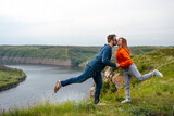 Happy in love romantic cheerful couple man and woman hug and kiss. the summer mountains adventure enjoy the local nature. Dniester river canyon, Subich, Ukraine