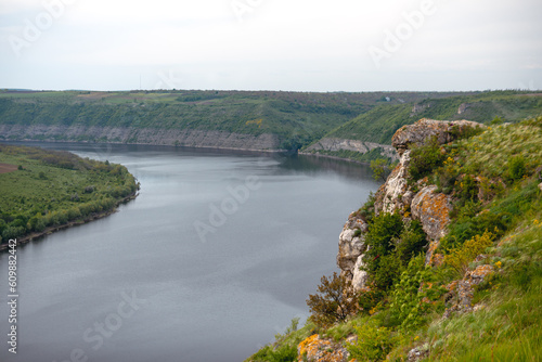 Canyon with the big, large river Dniester on an summer day near the village of Subich. Podolsk Tovtry. Beautiful nature landscape. Mountains and forest, Ukraine. Water resurvior. Copy space