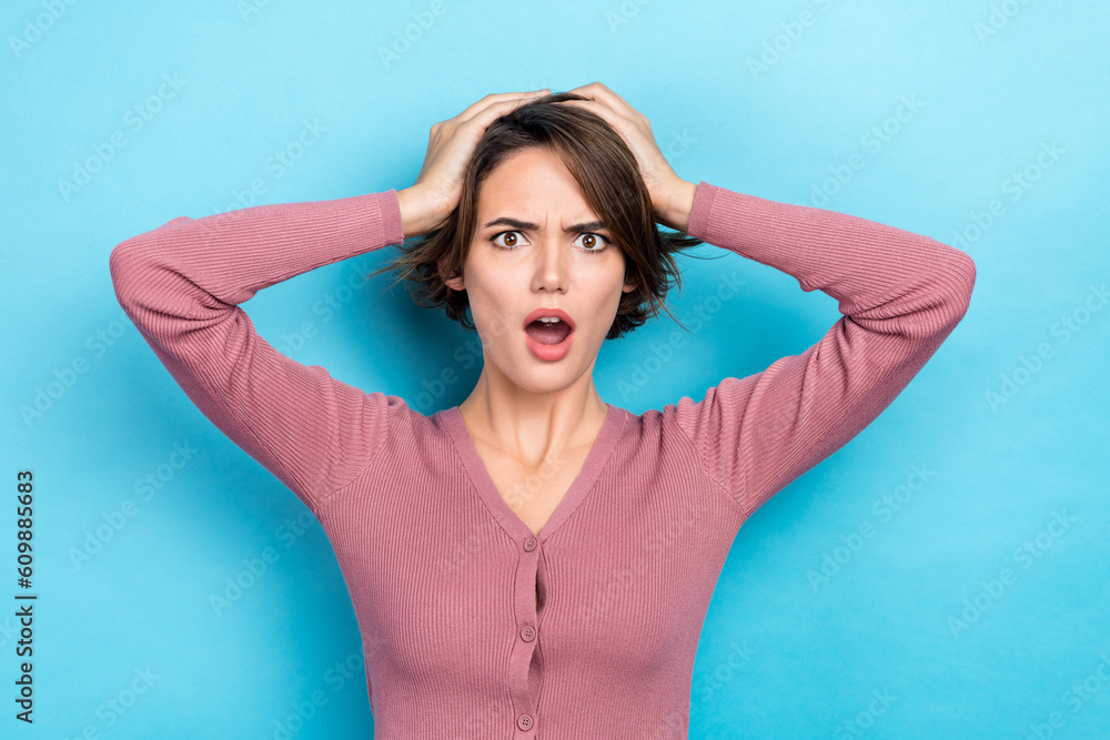 Photo of stunned shocked lady hold arms on head stupor bad news epic fail wear pink shirt isolated blue color background Photo of stunned shocked lady hold arms on head stupor bad news epic fail wear pink shirt isolated blue color background