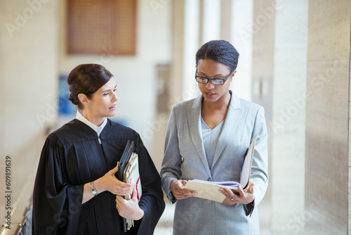 Judge and lawyer talking in courthouse