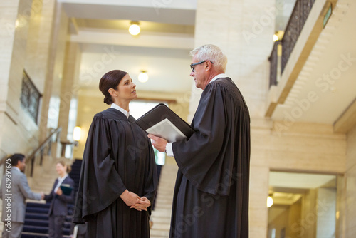 Judges talking in courthouse