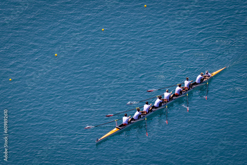 Men's eight rowing on Lake Bled