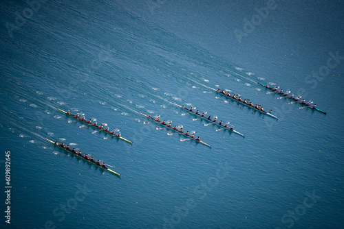 Men's Eight rowing boats rowing on Lake Bled