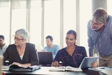 Students studying in adult education classroom