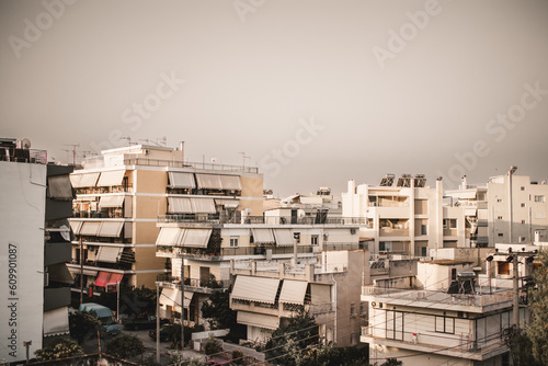 Greek apartment buildings in Athens during the sunset