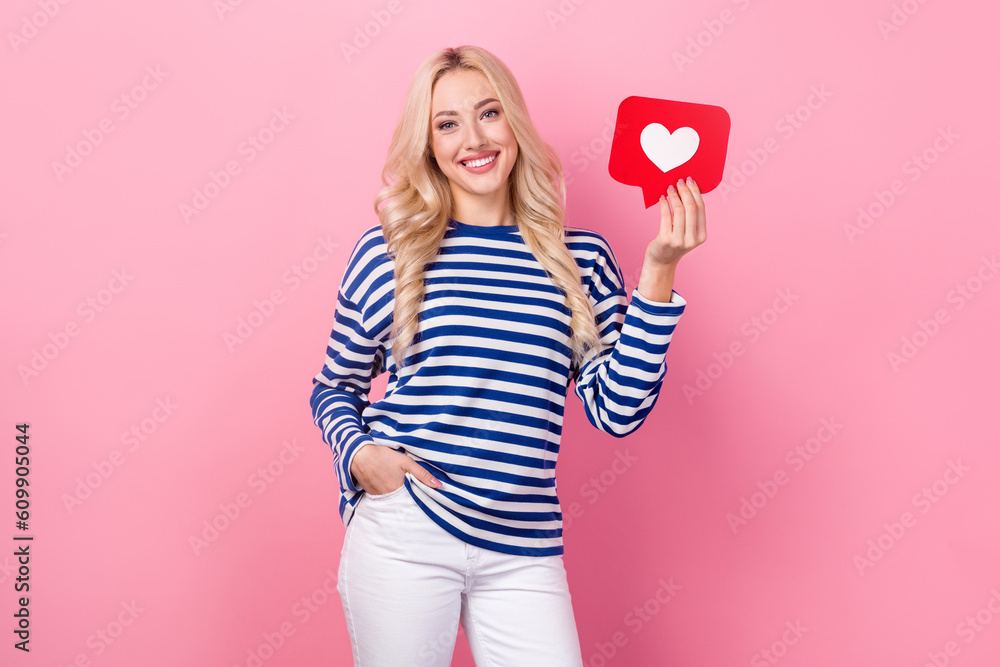 Photo of optimistic satisfied woman with wavy hairdo dressed striped shirt hold like icon arms in pocket isolated on pink color background Photo of optimistic satisfied woman with wavy hairdo dressed striped shirt hold like icon arms in pocket isolated on pink color background