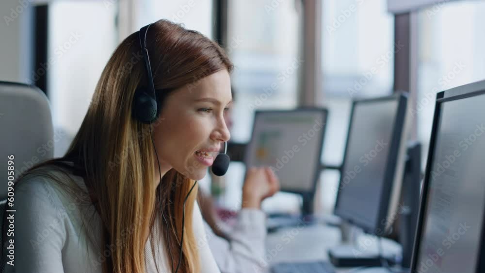 Call operator looking computer screen in office. Smiling saleswoman manager Call operator looking computer screen in office. Smiling saleswoman manager