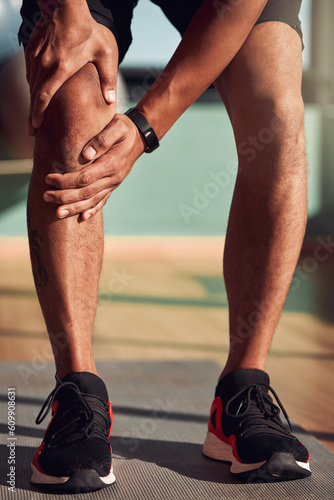 Fitness, exercise and legs of man with knee pain in gym with injury after running, training and workout. Medical accident, wellness and closeup of male person for muscle strain, joint ache and hurt