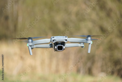The unmanned quadcopter hovered in the air. Modern unmanned technologies. Delivery of parcels by drones by air