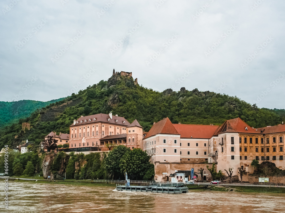 Small Austrian town on the banks of the Danube in the Wachau Valley, Austria. Beautiful village at the foot of the hill