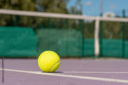 tennis ball on the net © Iliya Mitskavets