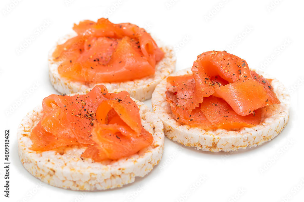 Tasty Rice Cake Sandwiches with Fresh Salmon Slices Isolated on White. Easy Breakfast and Diet Food. Crispbread with Red Fish. Healthy Dietary Snacks - Isolation
