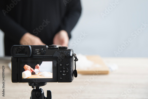people using digital camera taking food photograph or video studio production