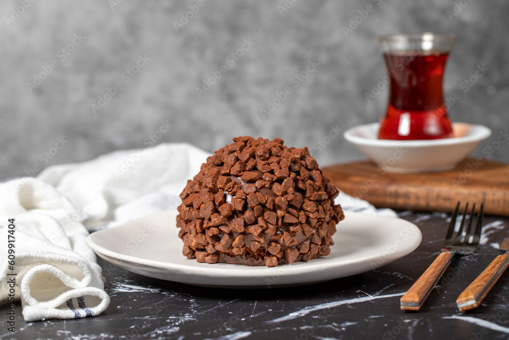 Chocolate cake. Mole cake with chocolate chips on dark background Chocolate cake. Mole cake with chocolate chips on dark background