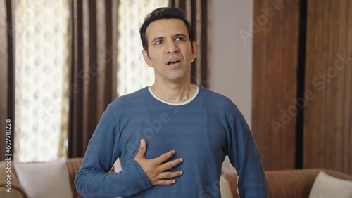 Indian man having acidity problem after eating
