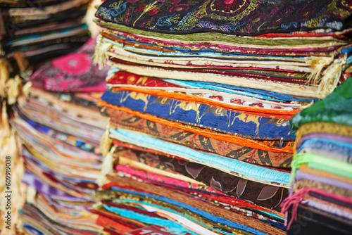 Various colorful carpets and fabrics on traditional Turkish market in Istanbul