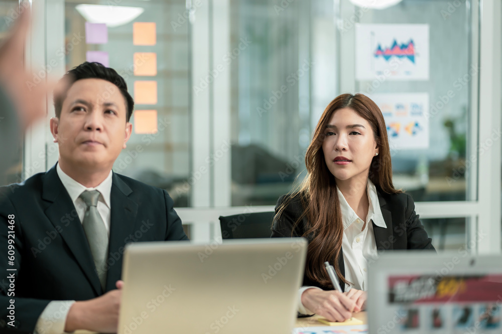 Modern Asian businessman with high confidence Committed to working together as a harmonious team Having a professional planning meeting at the company Modern Asian businessman with high confidence Committed to working together as a harmonious team Having a professional planning meeting at the company
