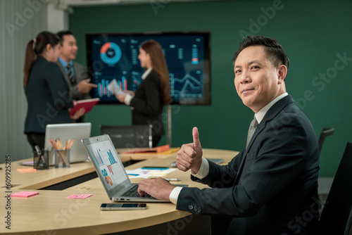 Modern Asian businessman with high confidence Committed to working together as a harmonious team Having a professional planning meeting at the company