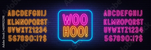 Woohoo neon sign in the speech bubble on brick wall background.