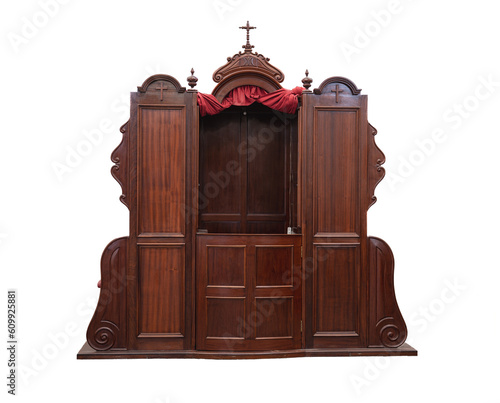 Detail of an old wooden confessional in a Spanish church, in Las Palmas de Gran Canaria on a white background photo