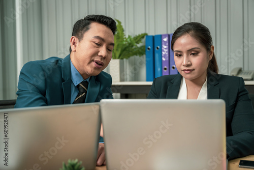 Modern Asian businessman with high confidence Committed to working together as a harmonious team Having a professional planning meeting at the company