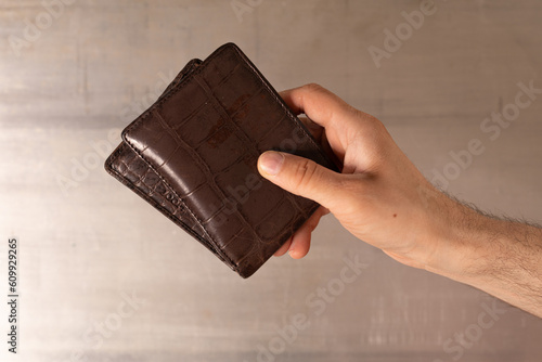 Man hand open an empty wallet on white background