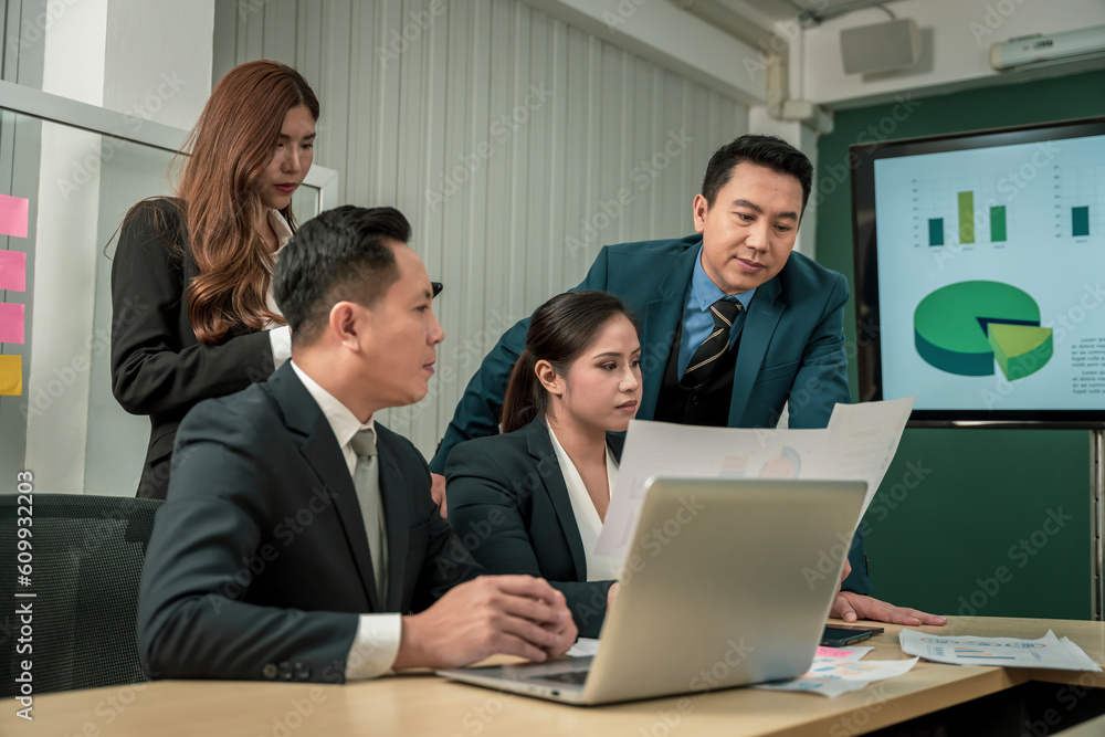 Modern Asian businessman with high confidence Committed to working together as a harmonious team Having a professional planning meeting at the company Modern Asian businessman with high confidence Committed to working together as a harmonious team Having a professional planning meeting at the company