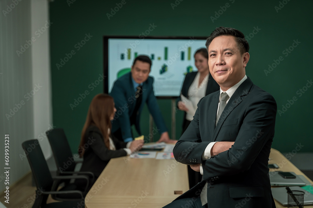 Modern Asian businessman with high confidence Committed to working together as a harmonious team Having a professional planning meeting at the company Modern Asian businessman with high confidence Committed to working together as a harmonious team Having a professional planning meeting at the company