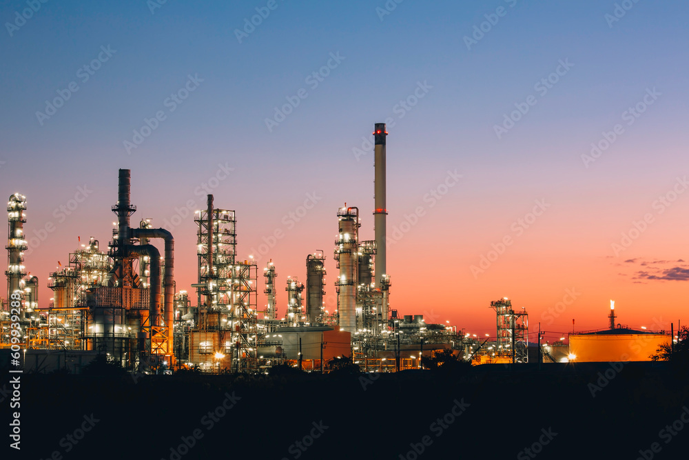 Scene of the oil refinery plant of petrochemistry Oil refinery and plant and flue smoke industry in oil and gas industry with cloud red and orange sky the morning Scene of the oil refinery plant of petrochemistry Oil refinery and plant and flue smoke industry in oil and gas industry with cloud red and orange sky the morning