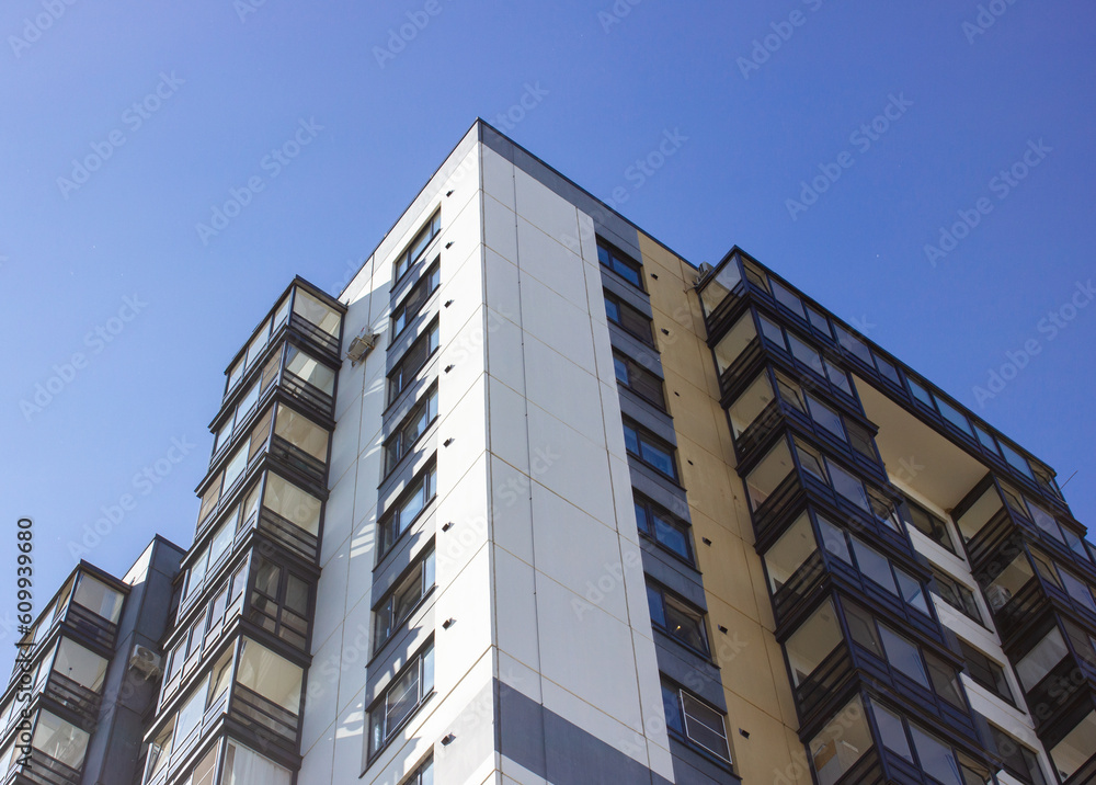 Multi-apartment modern house. Residential building, residential complex, apartments. Architecture, house design with balconies. House construction industry, industry. Renting, renting housing. Multi-apartment modern house. Residential building, residential complex, apartments. Architecture, house design with balconies. House construction industry, industry. Renting, renting housing.
