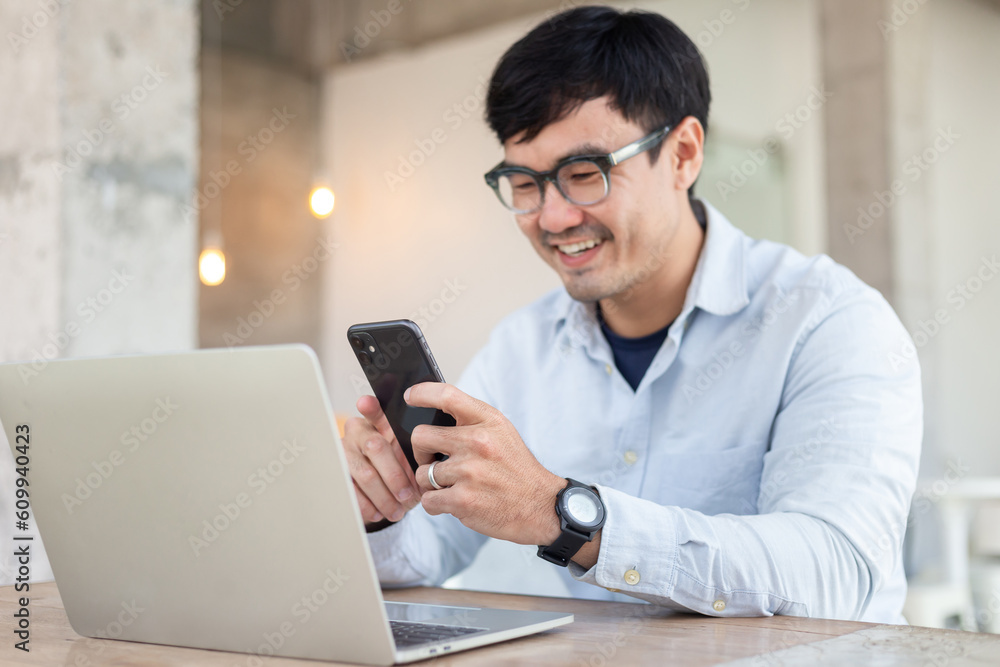man work using typing computer texting cell phone.student study education online learning.adult professional chatting on laptop,mobile contact us at Thinking business plan.connecting people concept man work using typing computer texting cell phone.student study education online learning.adult professional chatting on laptop,mobile contact us at Thinking business plan.connecting people concept