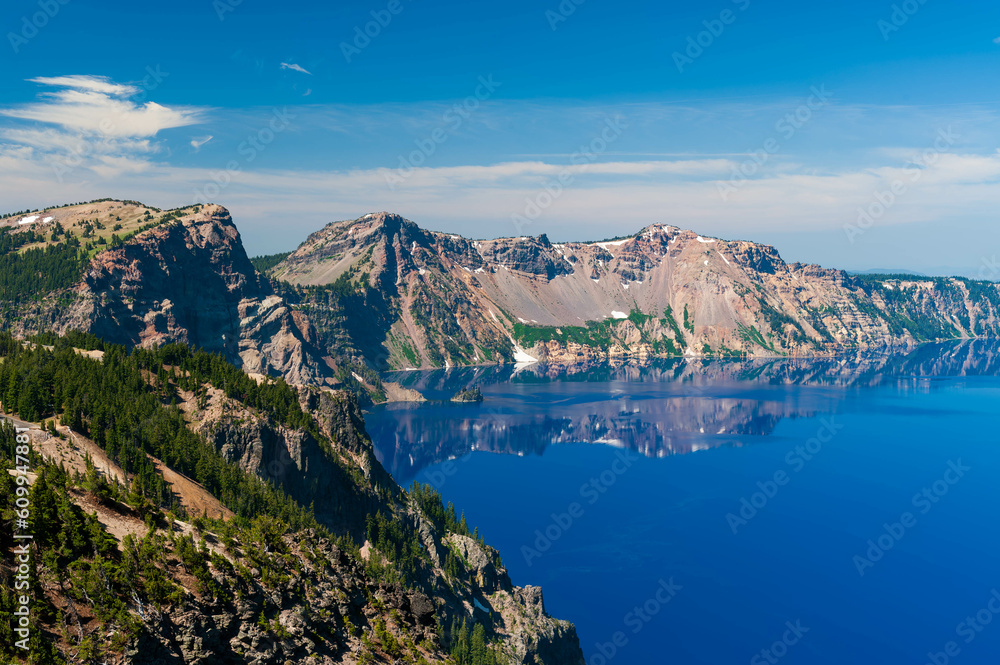 Phantom ship and Reflections of the mountains  in Crater Lake, Oregon, USA