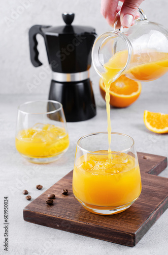 Bumble Coffee, Coffee with Orange Juice with Ice, Refreshing Drink on Grey Background