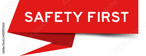 Red color speech banner with word safety first on white background