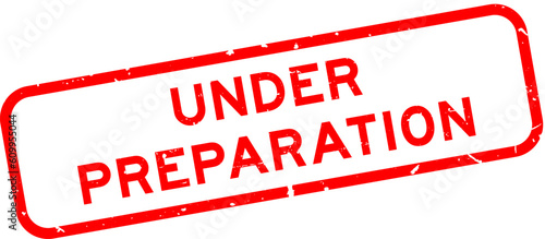 Grunge red under preparation word square rubber seal stamp on white background