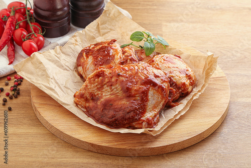 Marinated chicken leg in tomato sauce