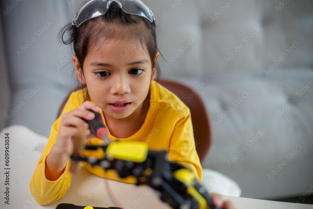 Stem education concept asian students learn at home by coding robot