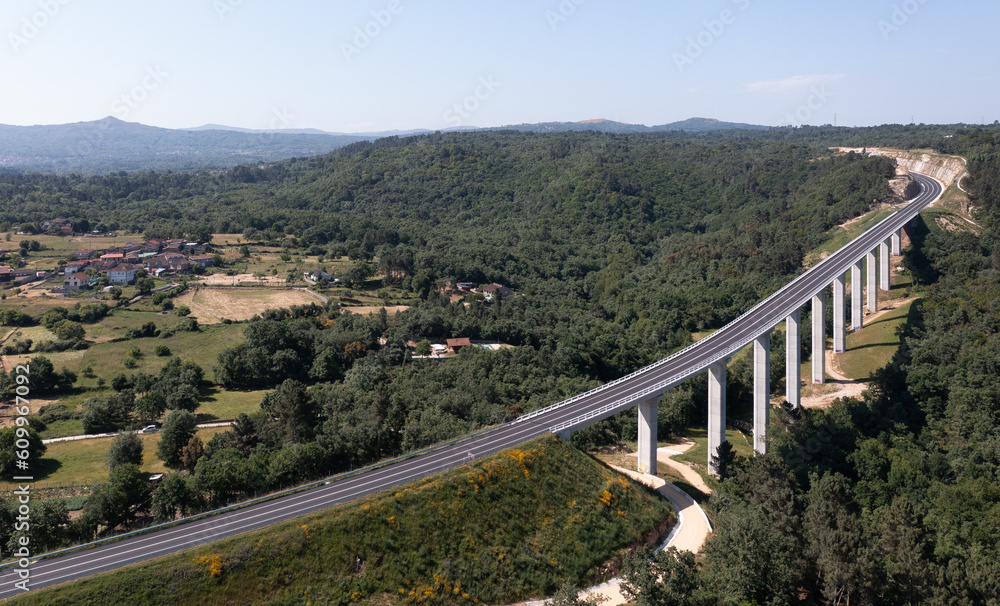 Drone view of countryside with bridge and green trees Drone view of countryside with bridge and green trees