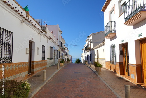 Street with white houses  in a traditional Andalusian village in southern Spain