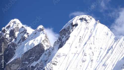Jagged high peaks of langtang Himalaya mountain peak 
Long shot from Nepal, 2023
 photo